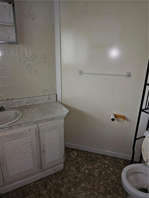 413 Electric Street New Castle, PA 16101 - Photo 18 of 23 a bathroom with a granite countertop sink and toilet