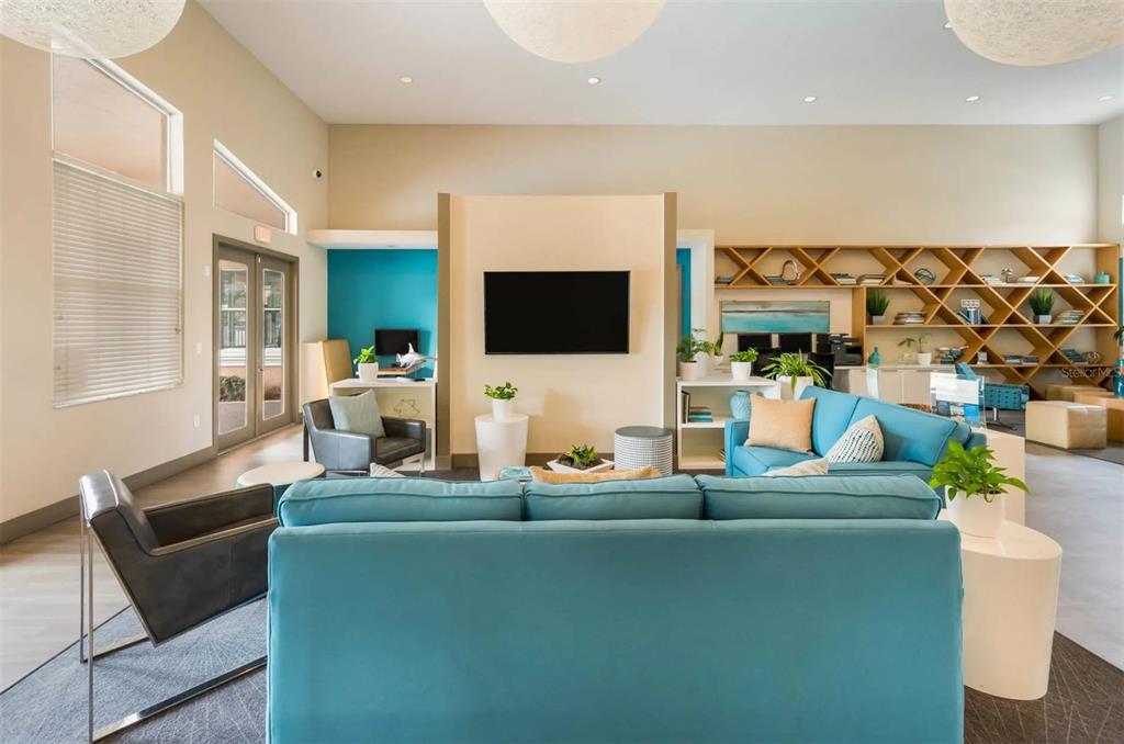 10101 Southwest 14th Street, Unit 3B10108 Pembroke Pines, FL 33025 - Photo 12 of 48 a living room with furniture and a flat screen tv