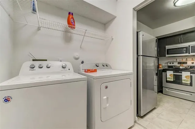 a utility room with dryer and washer