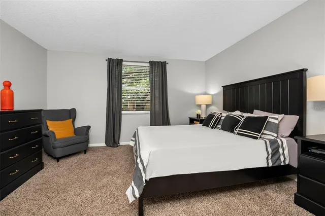 a bed room with a bed and a couch