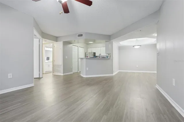 a view of a kitchen with a dishwasher cabinets and wooden floor