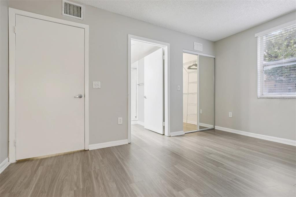 10101 Southwest 14th Street, Unit 3B10108 Pembroke Pines, FL 33025 - Photo 40 of 48 an empty room with wooden floor and windows