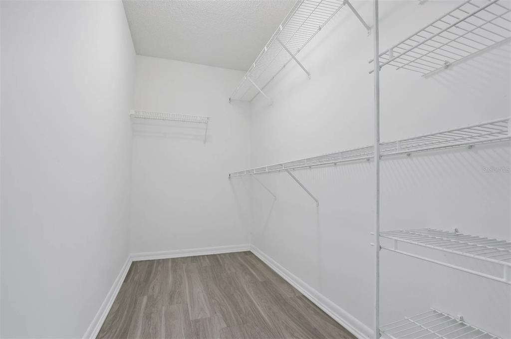 10101 Southwest 14th Street, Unit 3B10108 Pembroke Pines, FL 33025 - Photo 41 of 48 a view of a room with racks on the wall