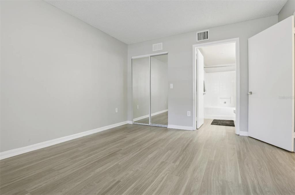 10101 Southwest 14th Street, Unit 3B10108 Pembroke Pines, FL 33025 - Photo 47 of 48 a view of an empty room with wooden floor