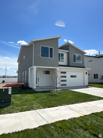 1225 West 500 South Logan, UT 84321 - Photo 3 of 39 Modern exterior featuring a two-story design with a gray stucco finish and white siding accents
