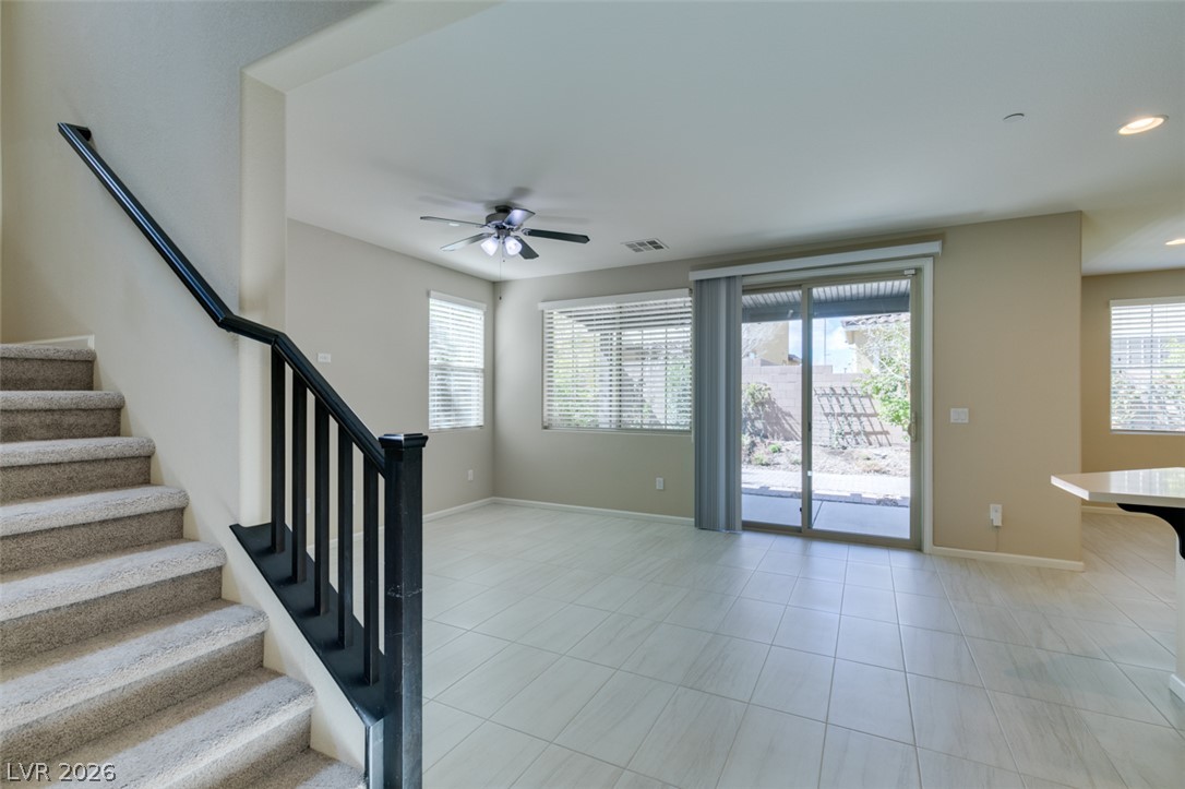 2549 Sable Ridge Street Henderson, NV 89044 - Photo 11 of 48 A well-lit living area features tiled flooring and convenient patio access.