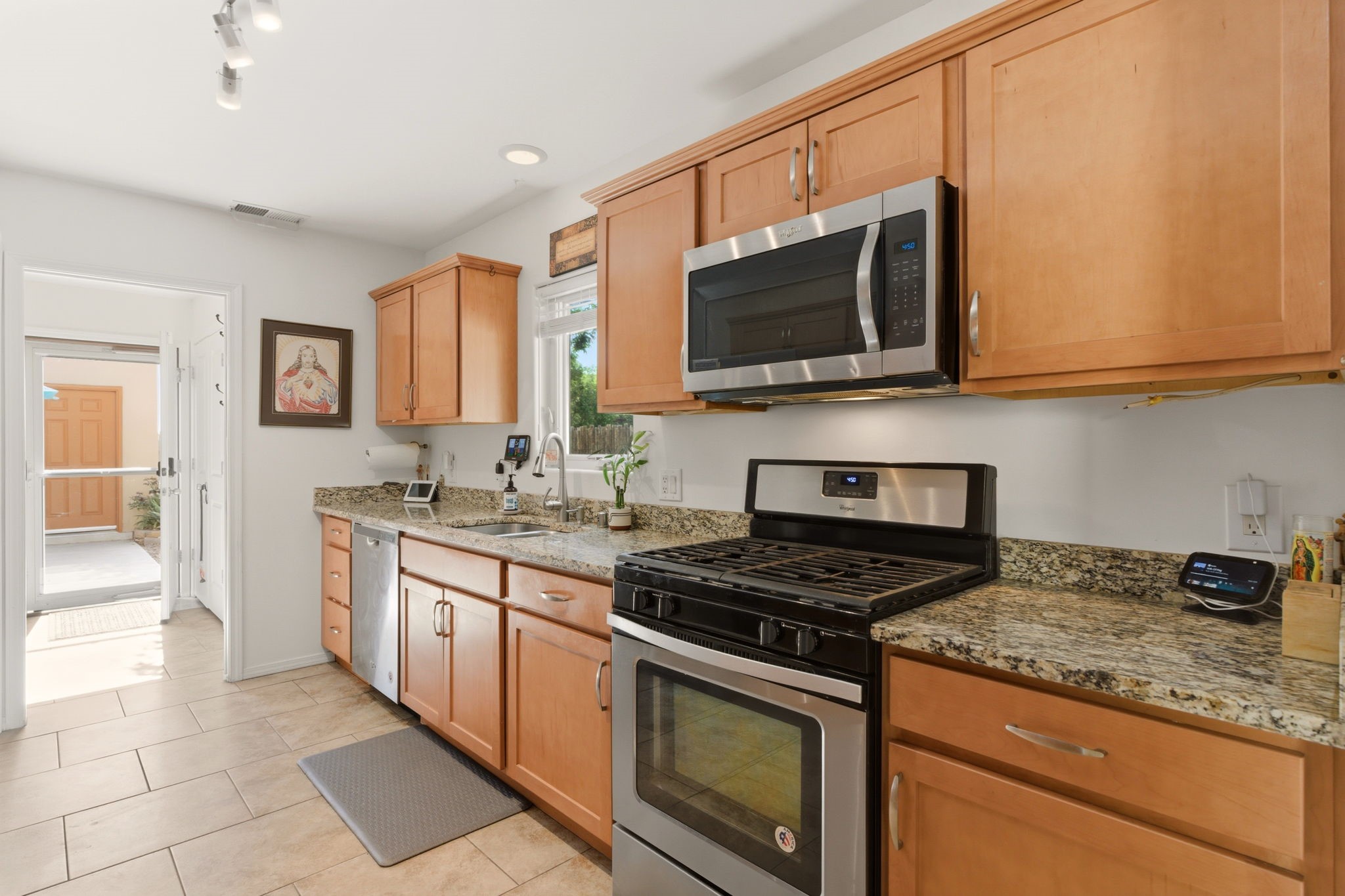 3 Silver Buckle Road Santa Fe, NM 87508 - Photo 4 of 34 Kitchen with granite counter tops leads to back door