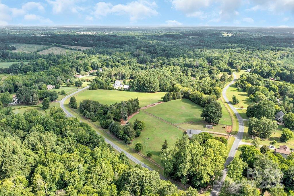 1900 Monterosa Road Concord, NC 28025 - Photo 12 of 46 an aerial view of residential houses with outdoor space and trees