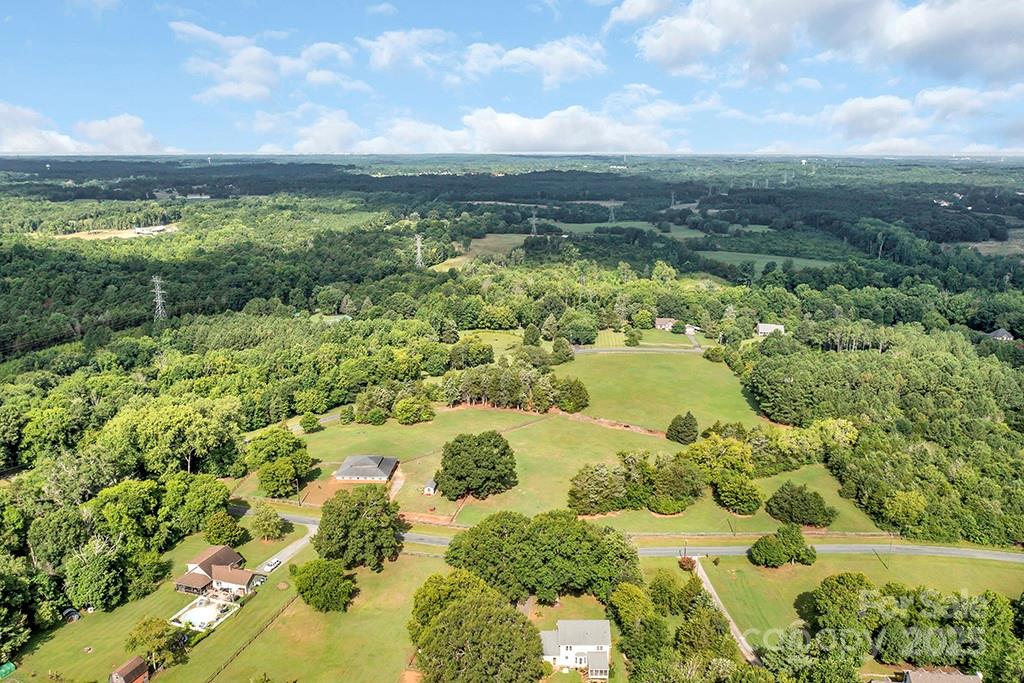 1900 Monterosa Road Concord, NC 28025 - Photo 16 of 46 a view of a lake with a yard