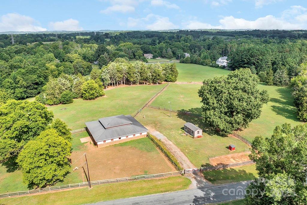 1900 Monterosa Road Concord, NC 28025 - Photo 22 of 46 an aerial view of a house with a garden and lake view