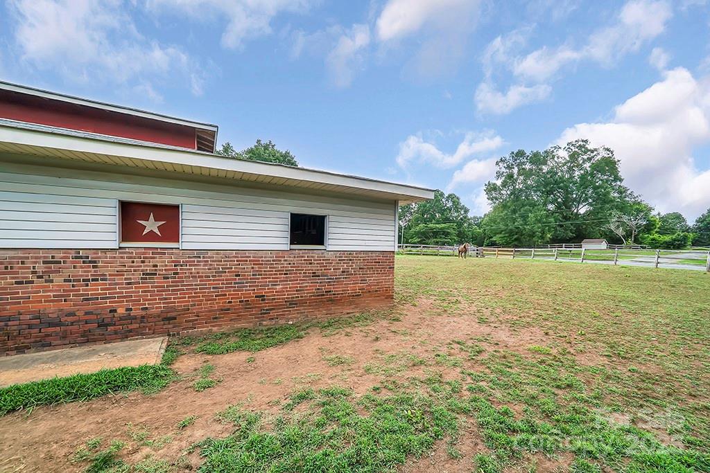 1900 Monterosa Road Concord, NC 28025 - Photo 29 of 46 a backyard of a house with lots of green space