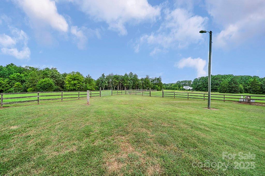 1900 Monterosa Road Concord, NC 28025 - Photo 37 of 46 a view of a golf course with a lake