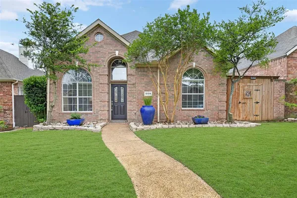 a house view with a garden space