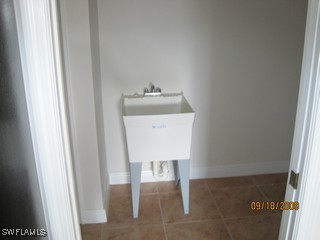 8342 Cardinal Road Fort Myers, FL 33967 - Photo 6 of 7 a utility room with dryer and washer