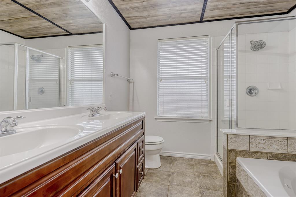 308 Butternut Drive Fate, TX 75087 - Photo 20 of 21 a bathroom with a sink a toilet and shower
