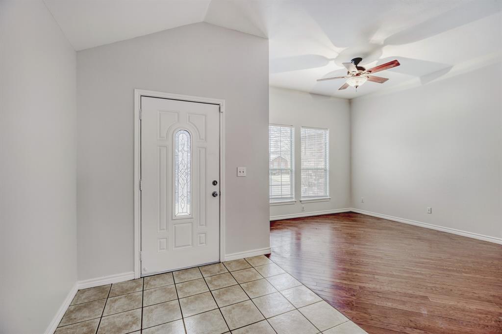 308 Butternut Drive Fate, TX 75087 - Photo 5 of 21 a view of an empty room with window and chandelier fan
