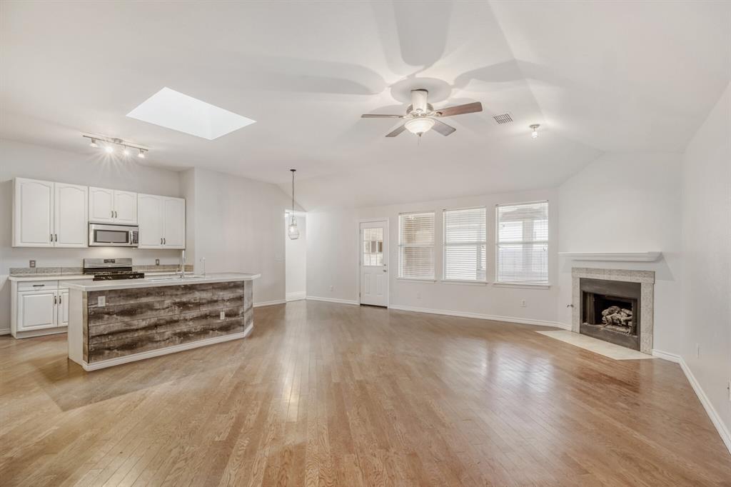 308 Butternut Drive Fate, TX 75087 - Photo 9 of 21 a view of kitchen with cabinets and wooden floor