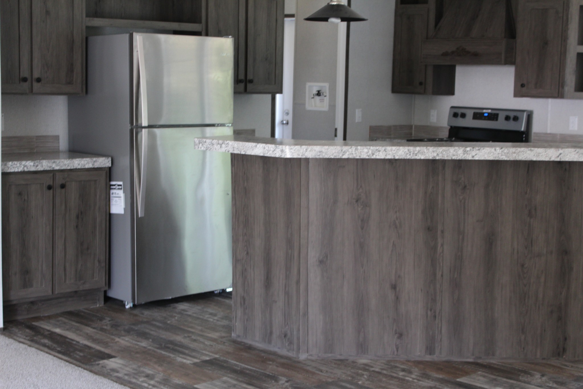 595 Days Road Lafayette, TN 37083 - Photo 20 of 21 a kitchen with stainless steel appliances granite countertop a refrigerator and a sink