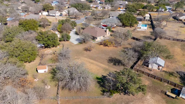 an aerial view of a house with outdoor space