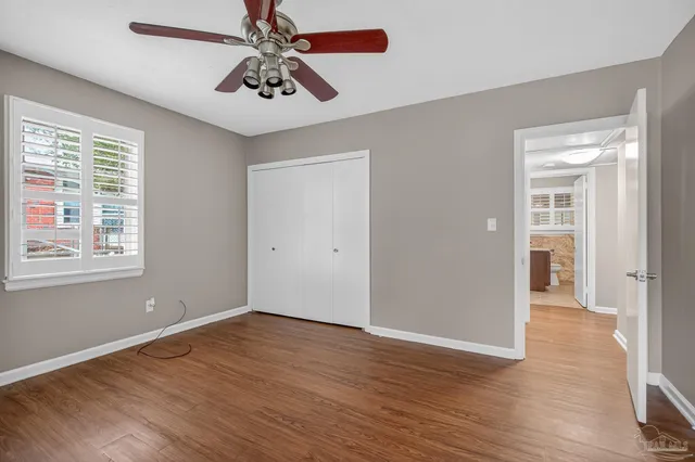 a view of hallway with wooden floor