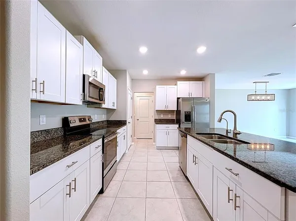 a bathroom with a glass shower door and a glass door