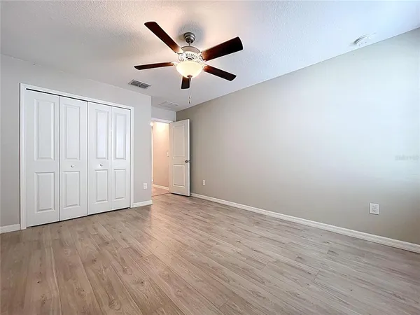 an aerial view of residential houses with outdoor space and swimming pool
