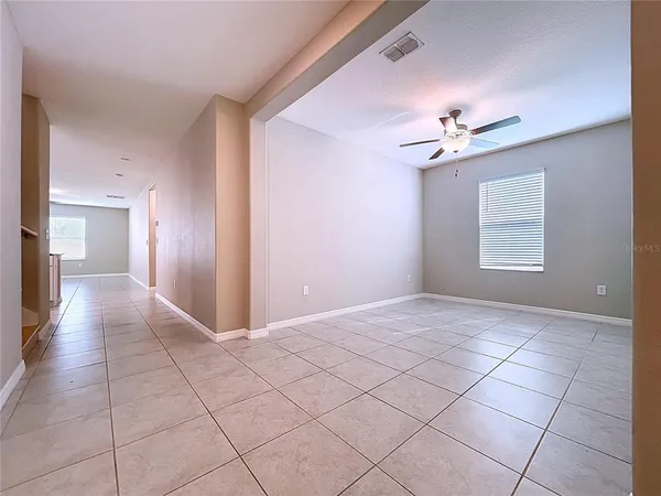 a kitchen with granite countertop white cabinets stainless steel appliances and a sink