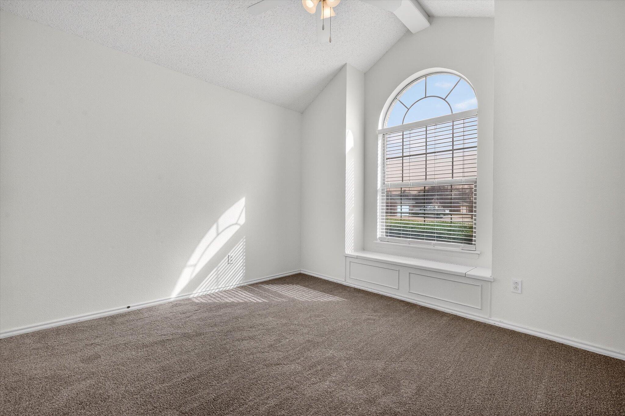 2216 97th Street Lubbock, TX 79423 - Photo 20 of 29 an empty room with a empty space and windows