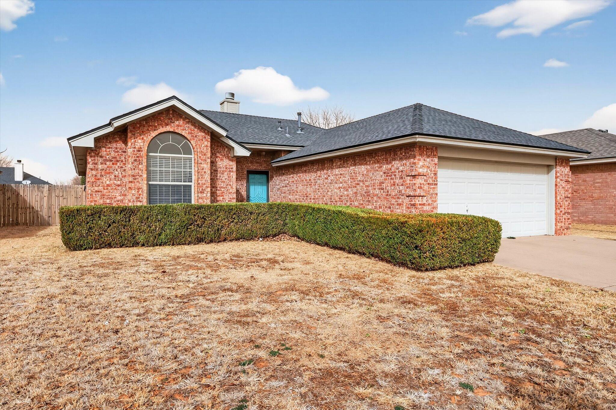 2216 97th Street Lubbock, TX 79423 - Photo 2 of 29 a view of a house with a yard
