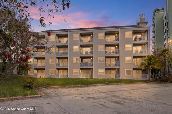 a bathroom with a shower and a glass door