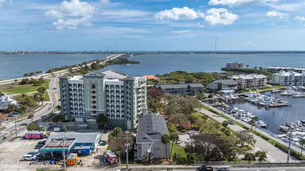 a kitchen with stainless steel appliances granite countertop a sink and a white cabinets