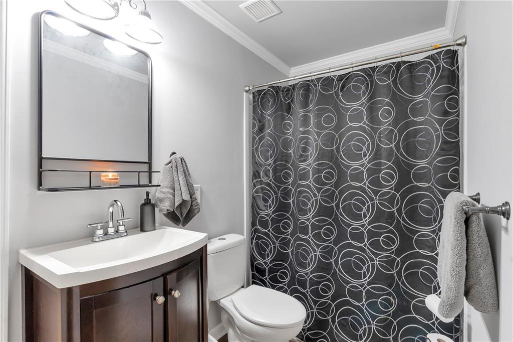 1224 Treemont Trace Winder, GA 30680 - Photo 18 of 27 a bathroom with a sink and a mirror