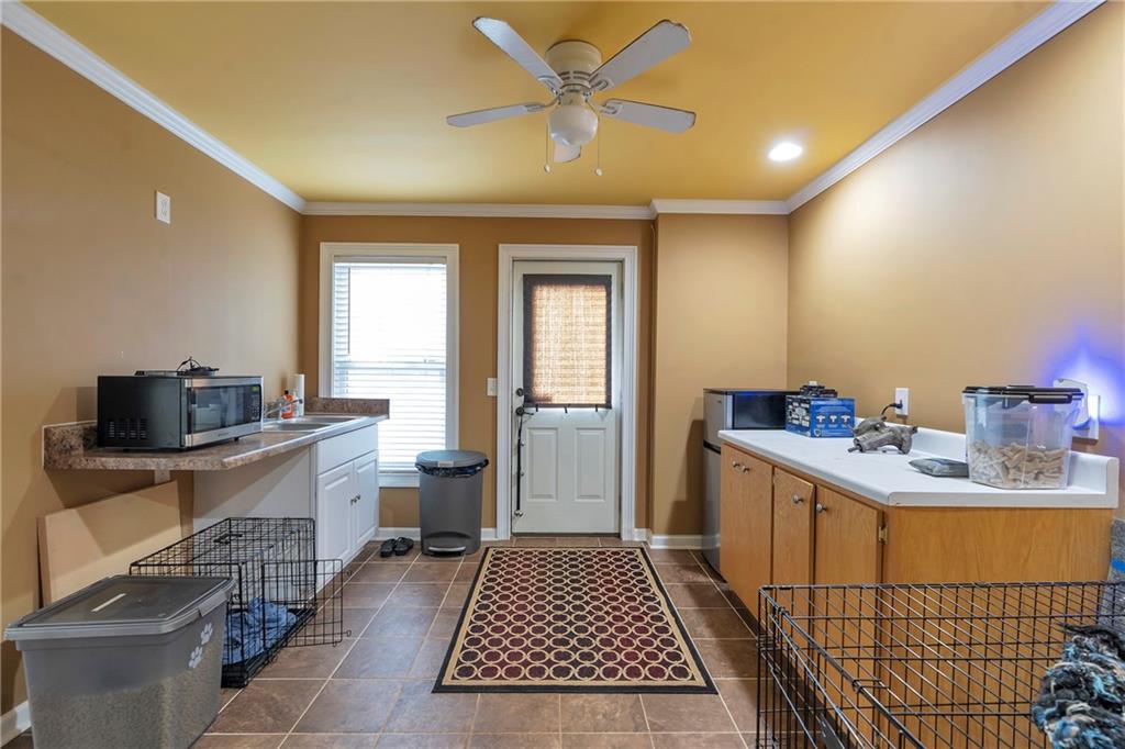 1224 Treemont Trace Winder, GA 30680 - Photo 21 of 27 a room with a washing machine and sink