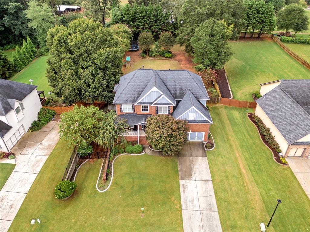 1224 Treemont Trace Winder, GA 30680 - Photo 24 of 27 a view of a swimming pool with a patio