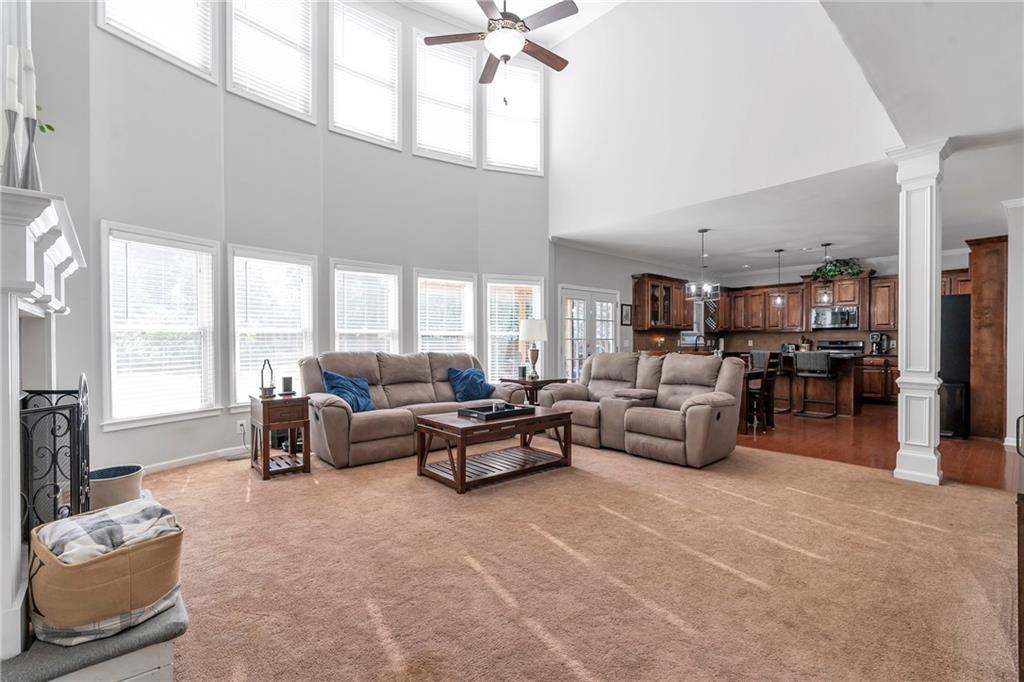 1224 Treemont Trace Winder, GA 30680 - Photo 3 of 27 a living room with furniture and a large window