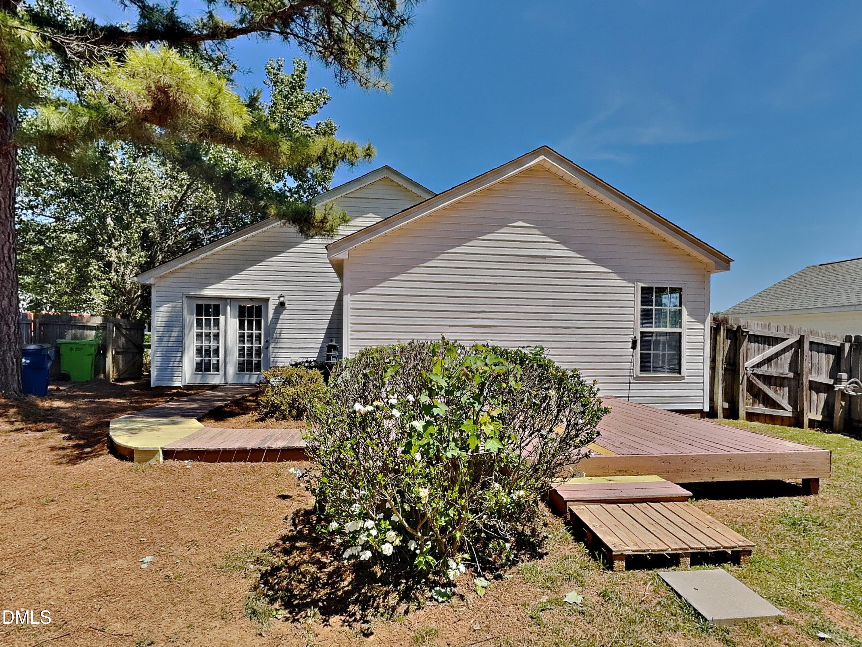 5516 Wilhagan Court Raleigh, NC 27616 - Photo 16 of 16 a view of a house with backyard and sitting area