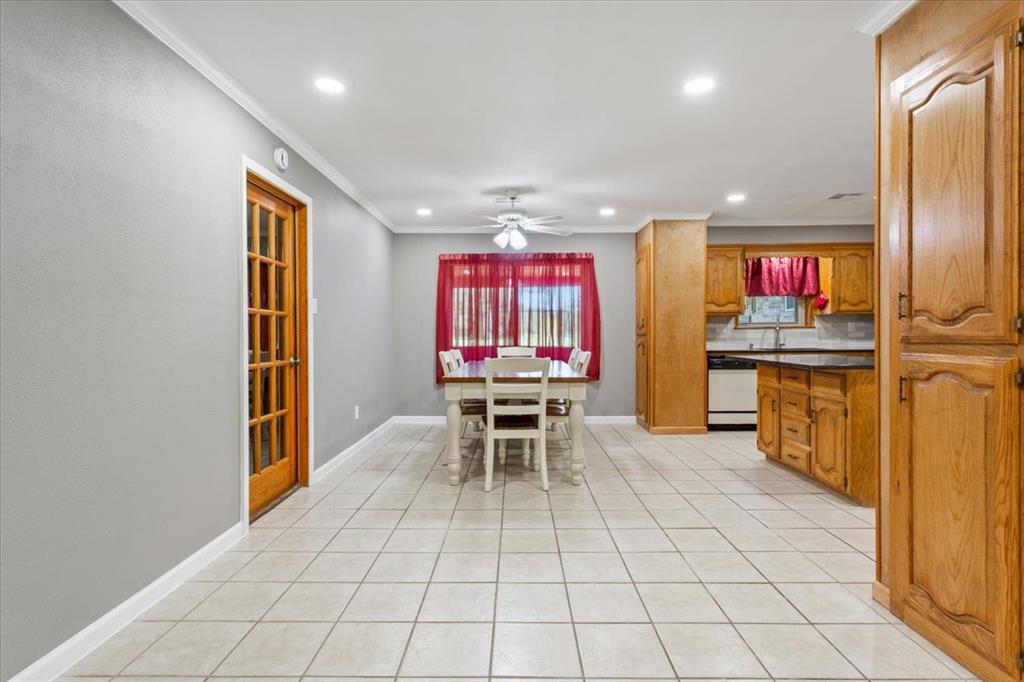 109 Hilltop Street Riesel, TX 76682 - Photo 11 of 32 an open kitchen with a sink and breakfast area
