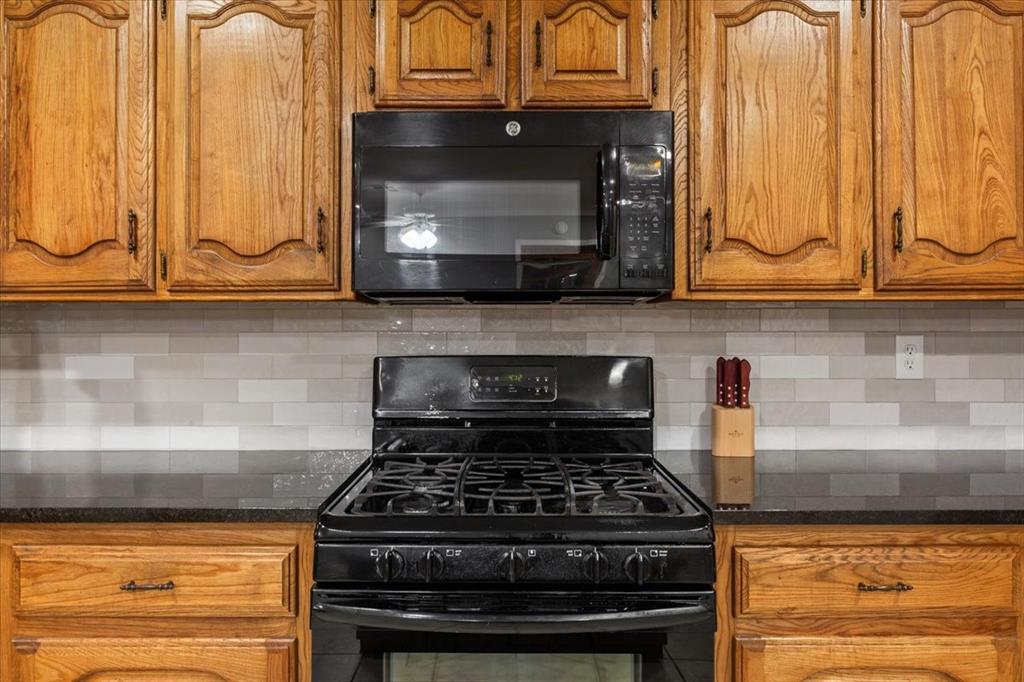 109 Hilltop Street Riesel, TX 76682 - Photo 15 of 32 a stove top oven sitting inside of a kitchen