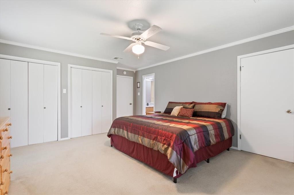109 Hilltop Street Riesel, TX 76682 - Photo 17 of 32 a bed room with a bed and a ceiling fan
