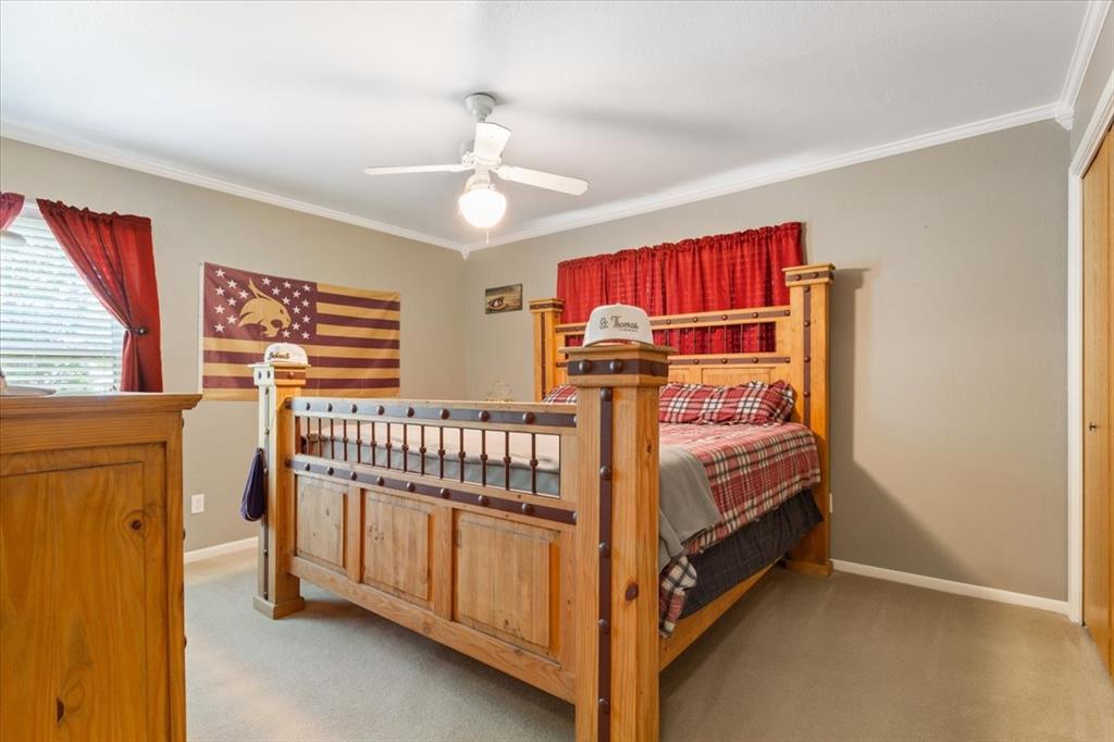 109 Hilltop Street Riesel, TX 76682 - Photo 20 of 32 a bedroom with a bed and window