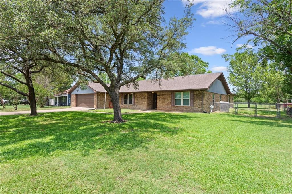 109 Hilltop Street Riesel, TX 76682 - Photo 3 of 32 front view of a house with a yard