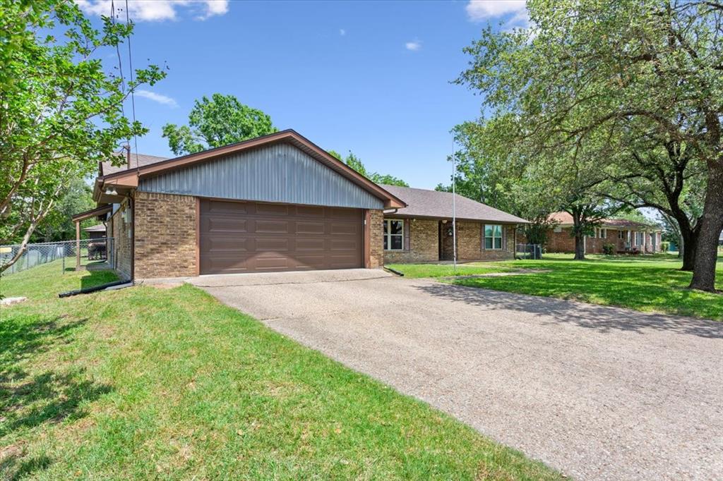 109 Hilltop Street Riesel, TX 76682 - Photo 4 of 32 a front view of house with yard and green space