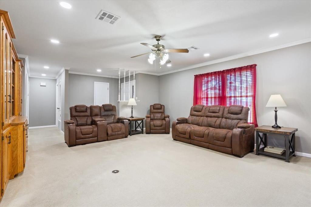 109 Hilltop Street Riesel, TX 76682 - Photo 7 of 32 a living room with furniture and a chandelier