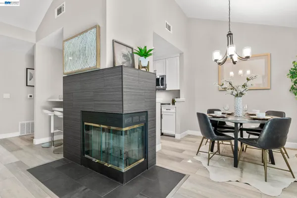 a dining room with furniture and chandelier