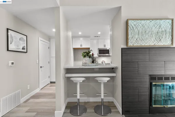 a kitchen with a sink cabinets and window