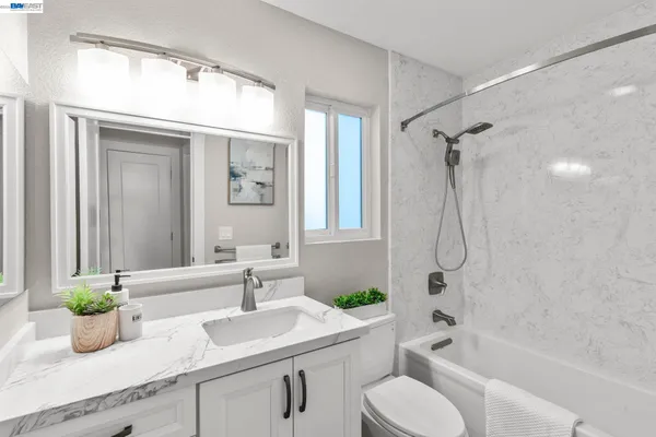 a bathroom with a sink a toilet and a bathtub