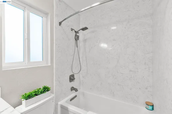 a bathroom with a bath tub