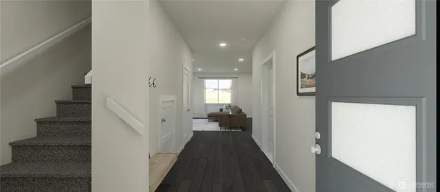 a view of a hallway with wooden floor and staircase