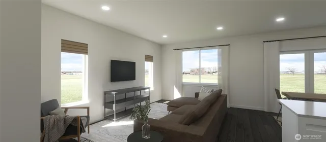 a living room with furniture a flat screen tv and a large window