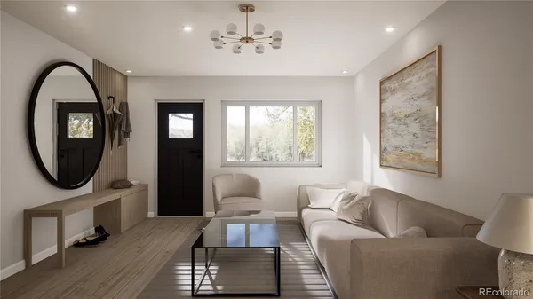 a living room with furniture a mirror and a window